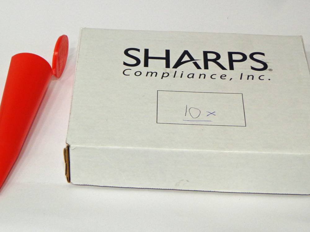 Safety \‘sharps\’ containers. 10 x red, cone shaped safety containers.